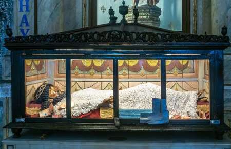 Manila, Philippines - March 5, 2019: San Augustin Church. Closeup of effigy of Christ lying in padlocked glass coffin under light.のeditorial素材