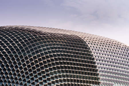 Singapore - March 21, 2019: Closeup of the roof pattern of Esplanade Theatres under light blue sky shows multitude of squares in different shapes and colors.のeditorial素材