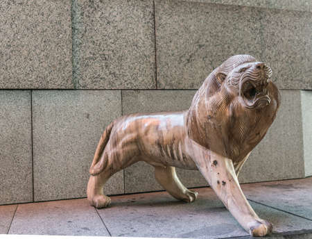 Singapore - March 22, 2019: Gardens by the Bay, the Flower Dome. One lion out of large group of brown lion statues on steps outside the dome.のeditorial素材