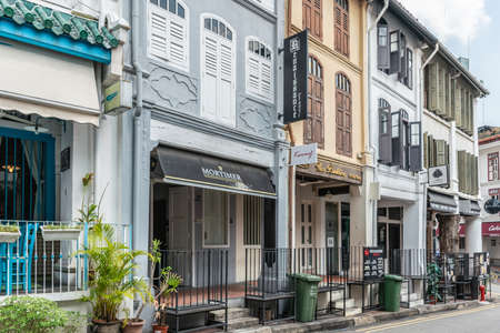 Singapore - March 22, 2019: Chinatown. Row of specialty restaurants and bars built in small traditional houses painted in different light colors on Club Street.のeditorial素材