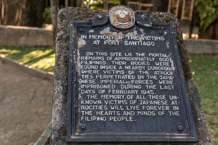 Manila, Philippines - March 5, 2019: Fort Santiago. Plaque as memorial for execution by Japan of over 600 Filipino and American prisoners at the fortress at end of February 1945. WW2.のeditorial素材