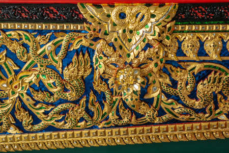 Bangkok city, Thailand - March 17, 2019: Royal Barge National Museum. Elaborate golden decorations with green, blue and white gemstones on Royal Barge Anekchart Phu-Chong.のeditorial素材