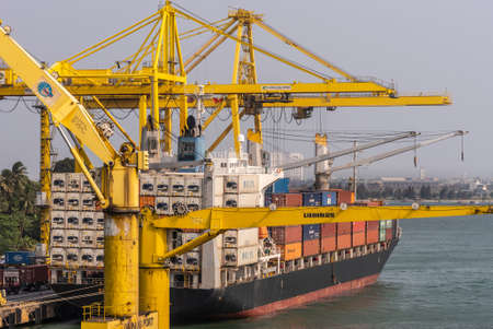 Da Nang, Vietnam - March 10, 2019: Tien Sa Port in Da Nang Bay. Multiple yellow cranes work on a...