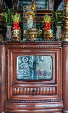 Nha Trang, Vietnam - March 11, 2019: Inside Farm house. Old brown wooden TV-cabinet refurbished into...