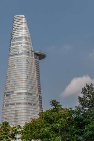Ho Chi Minh City, Vietnam - March 12, 2019: Downtown street scenery. Gray Bitexco financial tower...