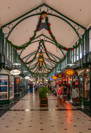 Port Douglas, Queensland, Australia - December 4, 2009: Rows of colorfully lighted and with Christmas ornaments in Port Village shopping mall. People walking inside.のeditorial素材