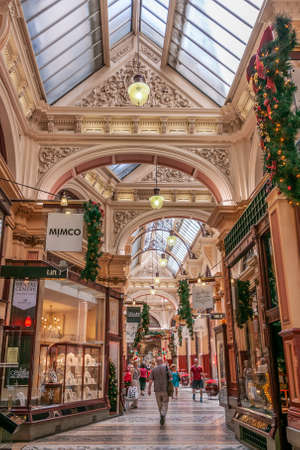 Melbourne, Australia - December 16, 2009: The Block Arcade shopping mall. Inside with people visiting shops during Chrismans time and its decorations. Beige brown walls and glass ceiling.のeditorial素材