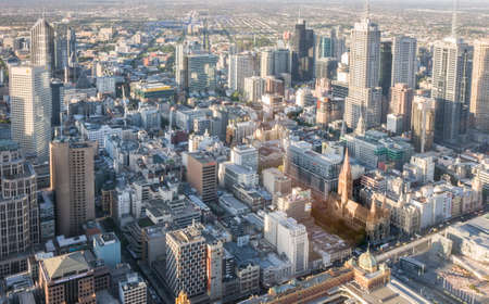 Melbourne, Australia - November 17, 2009: Aerial view on Saint Paul Cathedral with group of skyscrapers and Flinders Street Railway. Wide view on far extensions of the town.のeditorial素材