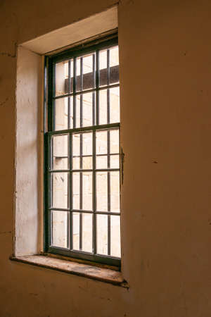Richmond, Tasmania, Australia - December 13, 2009: Closeup of 2-part Window set in beige brown wall...