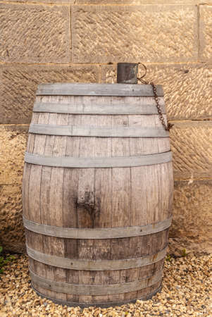 Richmond, Tasmania, Australia - December 13, 2009: Closeup of wooden water drinking barrel with...