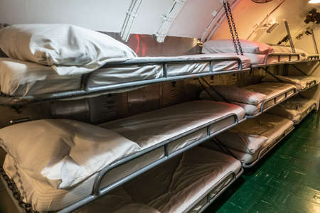 Oahu, Hawaii, USA. - January 10, 2020: Pearl Harbor. Sleeping quarter with hanging triple bunk beds...