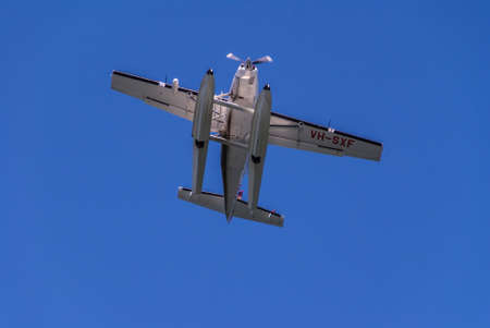 Sydney, Australia - December 11, 2009: Closeup of small flying white water-landing aircraft VH-SXF...