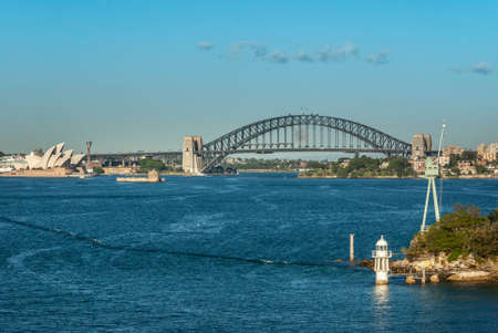 Sydney, Australia - December 11, 2009: Long shot with Opera House and Harbour Bridge, metal span,...