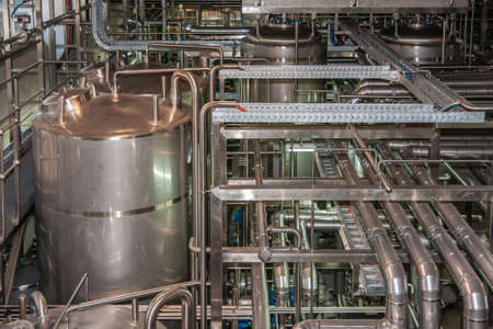 Brisbane, Australia - December 8, 2009: Castlemaine Perkins brewery. Intermediary tanks, plenty of...