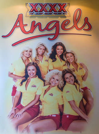 Brisbane, Australia - December 8, 2009: Castlemaine Perkins brewery. Closeup of poster with photo of 7 XXXX angels on display at The bar of visitor centre.のeditorial素材