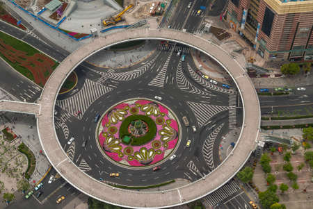 Shanghai, Pudong, Lujiazui, China - May 4, 2010: Birds eye view on ping and green roundabout at bottom of Oriental Pearl TV Tower with traffic and big circle pedestrian walkway under construction.のeditorial素材