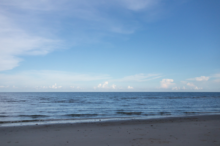 Beautiful sky and sea in the sunny day during the summer vacation in Thailand. The bright sunny day gives a cozy and relaxing feeling, it's a good day for doing activities outdoor along the beach and coastの写真素材