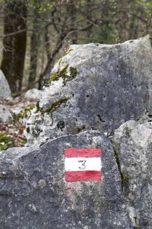 Red and white hiking trail signs symbol in European alps の写真素材