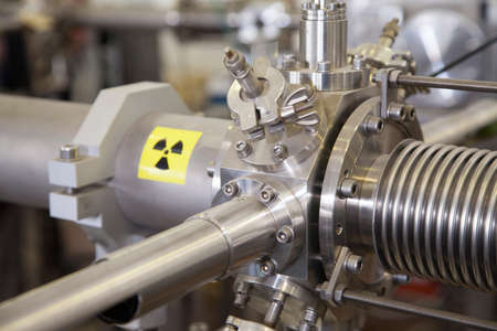 View of important electronic and mechanical parts of ION Accelerator, with high radiation warning  sign, CNC machined parts, selective focusの写真素材