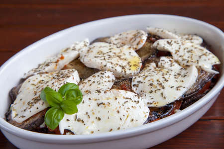 Tasty  vegetarian plate , mozarella with organic tomatoes and Mediterranean herbs