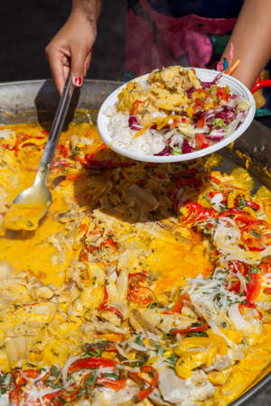 Serving Traditional Brasil food plate with fish meal, rice and organic vegetable, close up, selective focus on centerの写真素材