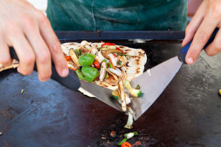 Chef serving Burrito - traditional Mexican foodの写真素材