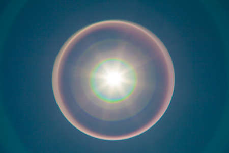 Solar lens flare with beautiful rainbowの写真素材