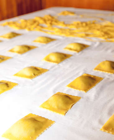 Making traditional italian pasta, ravioli, tagliatelle, fettuccini, step by step processの写真素材