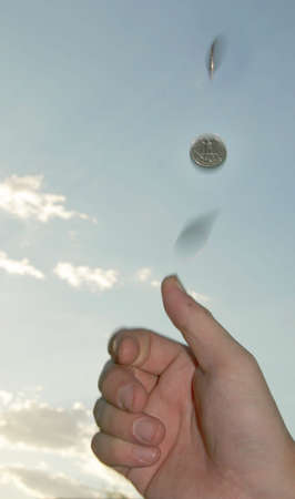 flipping a coinの写真素材
