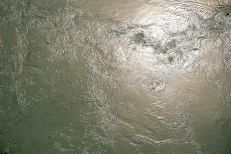 very turbulent water with sunlight reflection