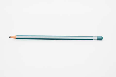 A silver and light green striped sharp wood pencil crayon isolated on a nicely white backgroundの写真素材