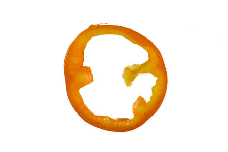 Res colored single ripe tomato ring isolated on an empty white paper background