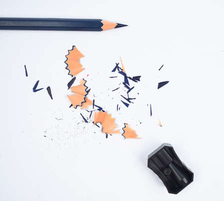 Study materials containing a blue pencil and a single black color plastic sharpener