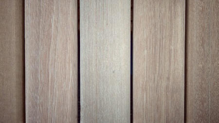 Wood panels run vertical along an interior wall.の写真素材