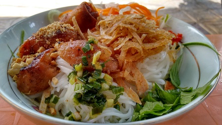 White bowl with noodle and meat and vegetablesの写真素材