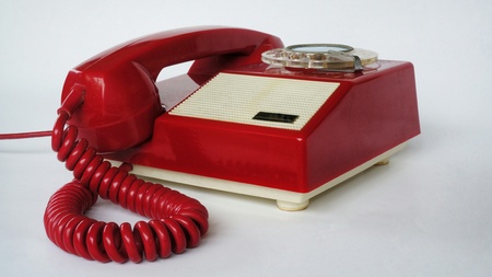 Telephone. Old red chinese phone. Photography of vintage fix line phone.