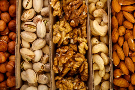Assorted nuts set in eco cardboard packaging.