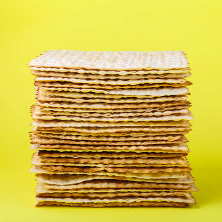 Pesach matzo on a yellow background. Squareの写真素材