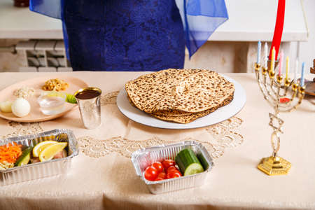 Set table for the Passover Seder with candles.