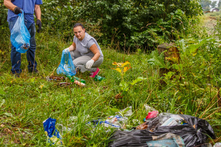 volunteers removes garbage from a landfill in nature.の写真素材