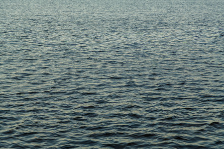 Water surface without waves on the river texture. Horizontal photoの写真素材