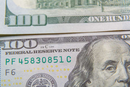 Fragments of dollar bills on the surface, very close-up.