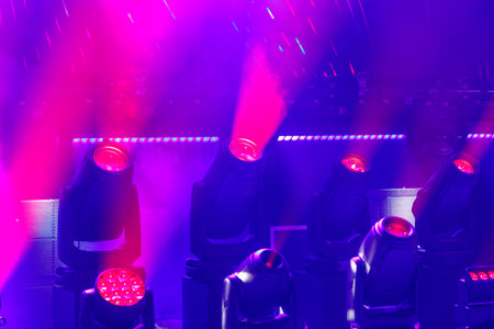 Neon pink professional light from spotlights beams on stage. horizontal photoの写真素材