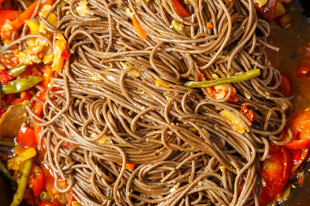 Soba with vegetables in soy sauce and teriyaki in a frying pan hot coarse. horizontal photoの写真素材