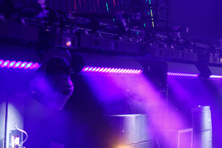 The neon purple light from the spotlights of the cannons streaked across the stage professionally exposed. horizontal photoの写真素材