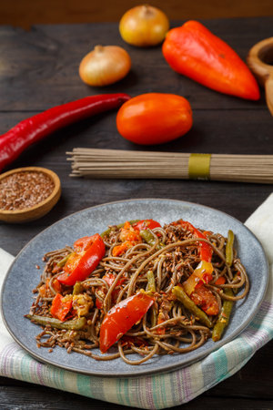 Asian food with an abundance of soy sauce and spices on a wooden table freshly prepared. vertical photoの写真素材