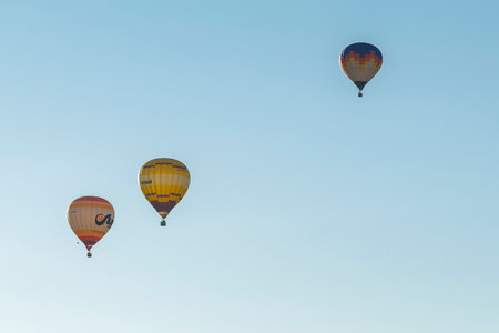 July 30, 2022 Russia, Pereslavl Zalessky Lake Pleshcheyevo. Hot air balloons in clear blue sky. horizontal photoのeditorial素材