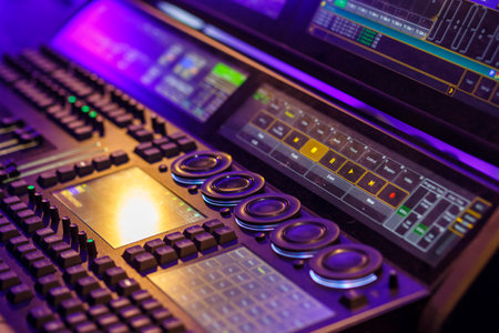 Professional stage light control panel in purple light. horizontal photoの写真素材