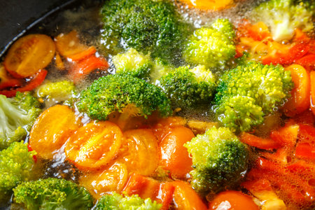 Stewed vegetables bright beans broccoli tomatoes stewed with spices close-up. horizontal photoの写真素材