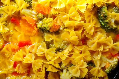 Farfalle pasta with stewed vegetables and spices.close-up. horizontal photoの写真素材